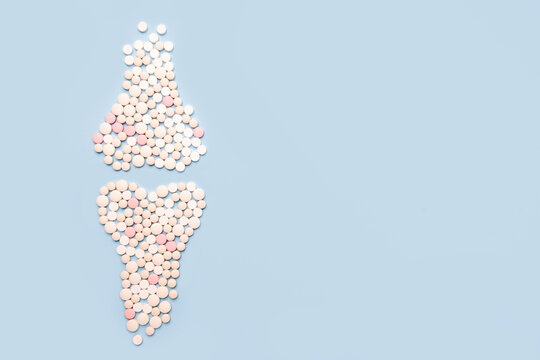 World osteoporosis day. Human  joints and bone made of pills on blue background