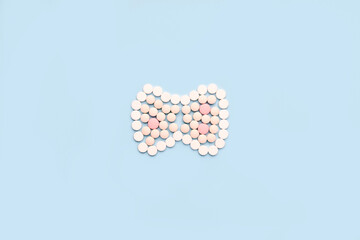 Thyroid gland made of pills. A symbol of protection and prevention from thyroid diseases