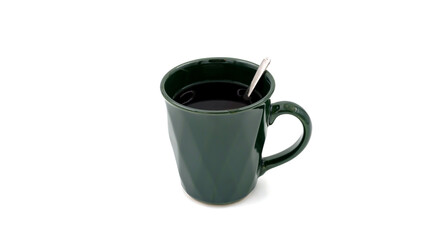 A cup of brewed bergamot tea with a green mug and teaspoon