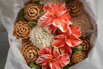 Zephyr bouquet of flowers in a gift box on a light background