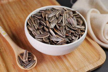 sun flower seeds in a bowl on table 