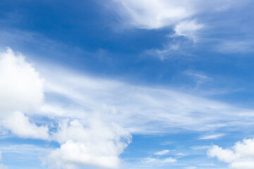Blue color sky with white fluffy cloud background