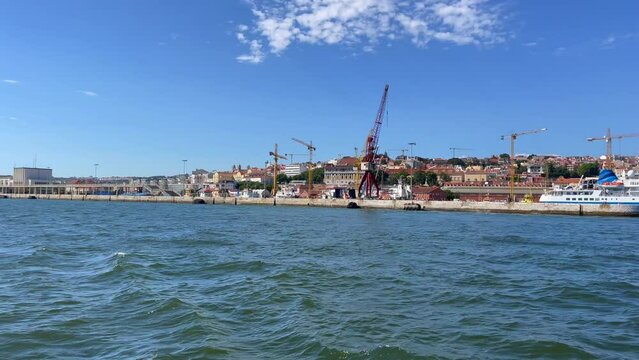 View from a tour boat passing by the Port of Lisbon, Portugal