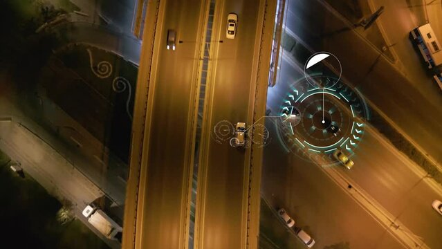 Top down aerial drone view of autonomous self driving cars moving through city Spbd. traffic on junction. Artificial intelligence in automotive industry. contol concept. High quality 4k footage