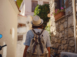 Marmaris is resort town on Turkish Riviera, also known as Turquoise Coast. Marmaris is great place for sailing and diving. Tourist Woman on Beautiful Streets of old Marmaris.