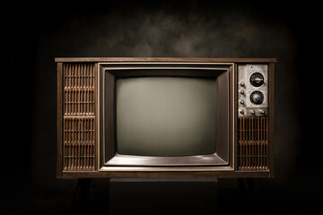 Retro old television with blank screen on a black background