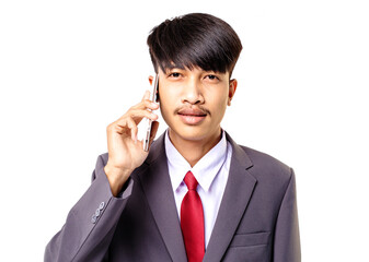portrait of young Asian man wearing gray suit using mobile phone isolated on white studio background