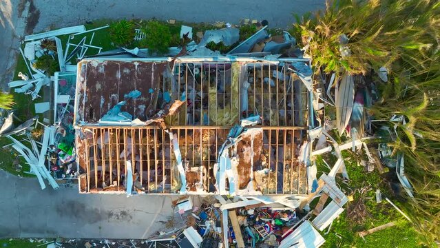 Badly damaged mobile homes after hurricane Ian in Florida residential area. Consequences of natural disaster