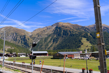 Scenic view of mountain village Oberwald, Canton Valais, seen from railway station on a sunny late...