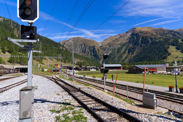 Scenic view of mountain village Oberwald, Canton Valais, seen from railway station on a sunny late...