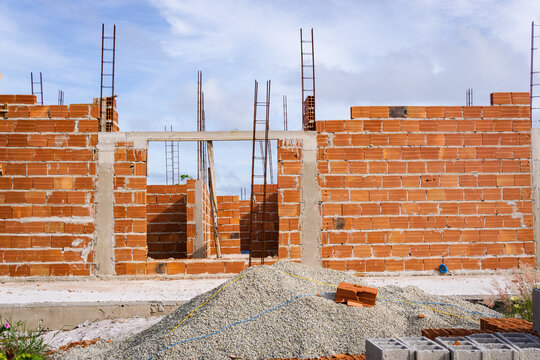 Stack of orange clay bricks for masonry homebuilding in Brazil
