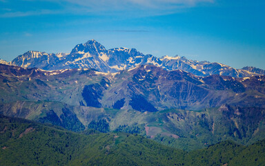 View on the snow covered Pyrenees mountains range from the summit of Tuc de l'étang in the south of France near Mourtis ski resort