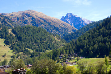 Fototapeta na wymiar Scenic view of mountain panorama seen from mountain village Oberwald, Canton Valais, on a sunny late summer day. Photo taken September 12th, 2022, Oberwald, Switzerland.