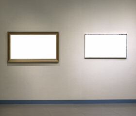 two empty picture frames isolated on wall