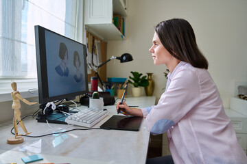 Obraz na płótnie Canvas Woman designer artist working in home, using graphic tablet computer