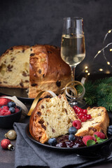 Traditional Italian Christmas fruitcake panettone with raisins and candied fruits. Holiday food for Christmas and New Year	