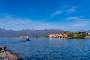 Ferry at the lake Maggiore, landscapes over the lake, in the background Isola Bella - island Bella in Italy