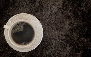 coffee with white cup with dark background written 2023, happy new year 2023