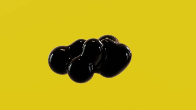 Floating spheres of oil droplets in the air or zero gravity. Emerging from the one droplet on a yellow background.
