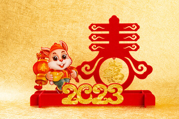 Chinese New Year of Rabbit mascot on golden background the Chinese words means springtime and fortune no logo no trademark