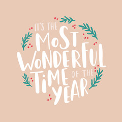 It's the most wonderful time of the year. Christmas greeting card. Inspirational winter quote with branches and lettering. Holiday design for invitation cards, brochures, poster, t-shirts, mugs © tanyabosyk
