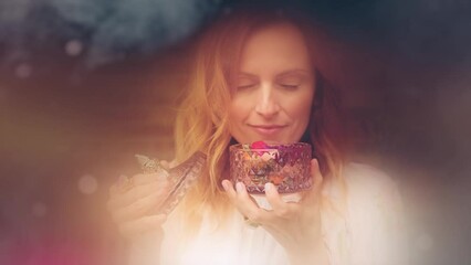 young beautiful woman with rose flowers in her hands.