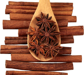 Cinnamon sticks and stars anise over white background