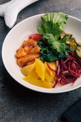 Bowl with salmon and mango