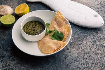 Chebureki with sauce restaurant serving