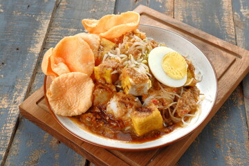 ketoprak-indonesian Traditional street food.dish of rice cake,rice noodles, bean curd, egg,boiled...