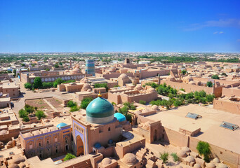 Beautiful aerial view of the 2500-year-old city Khiva. Ancient Itchan Kala fortress, Mosque, market...