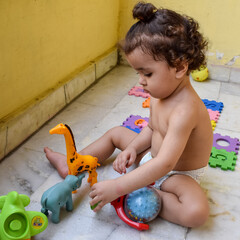 Fototapeta premium Cute little boy Shivaay Sapra at home balcony during summer time, Sweet little boy photoshoot during day light, Little boy enjoying at home during photo shoot