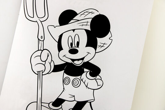 Coloring magazine with the character of Mickey Mouse the farmer. Walt Disney book with activities for young children. Black and white book for painting and drawing.