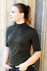 portrait of a young woman with ponytail in a turtleneck