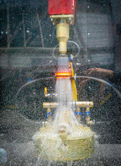 water drops for cooling on the glass of the induction hardening machine