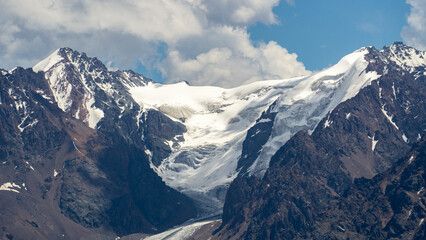 permafrost. glaciers. snowy mountain peaks and cliffs. snowy mountains in hot summer. mountain...