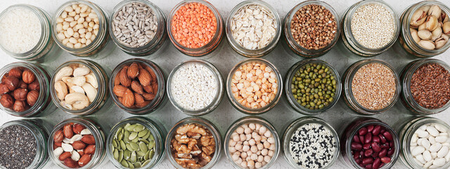 Vegan protein source. healthy vegetarian food. top view of seeds, nuts, pea, bean, rice, spelt,...