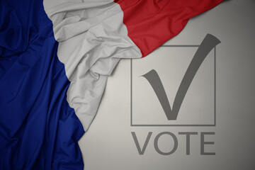 waving colorful national flag of france on a gray background with text vote. 3D illustration