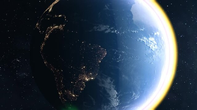 earth and sun in space while the flashes of the sun make a new day dawn on earth