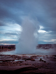 Geyser eruption closeup. The Great Geysir hot spring in Iceland. 