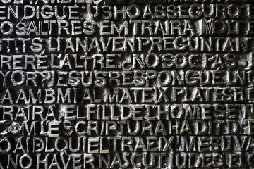 Carved letters on stone wall