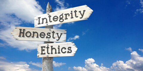 Integrity, honesty, ethics - wooden signpost with three arrows
