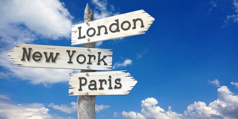 London, New York, Paris - wooden signpost with three arrows