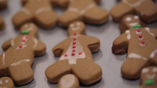 Cookies "gingerbread men" on baking tray. Homemade gingerbread for Christmas holidays.