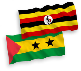 National vector fabric wave flags of Saint Thomas and Prince and Uganda isolated on white background. 1 to 2 proportion.