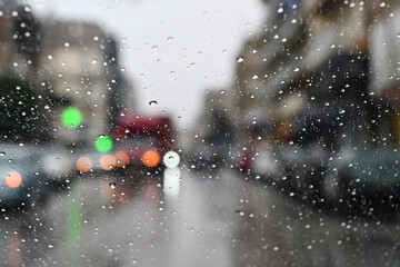 driver's view of the city on a rainy day