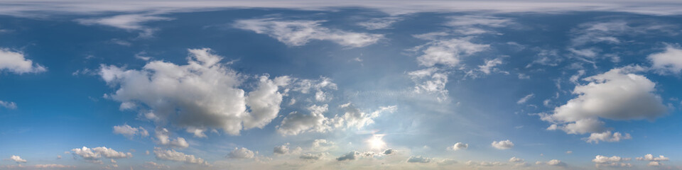blue sky with beautiful clouds as seamless hdri 360 panorama view with zenith in spherical equirectangular format for use in 3d graphics or game development as sky dome or edit drone shot