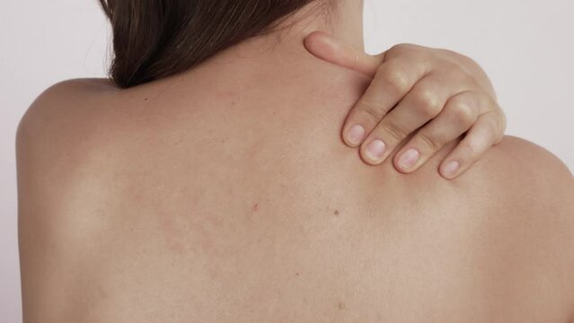 Woman with shoulder blade pain