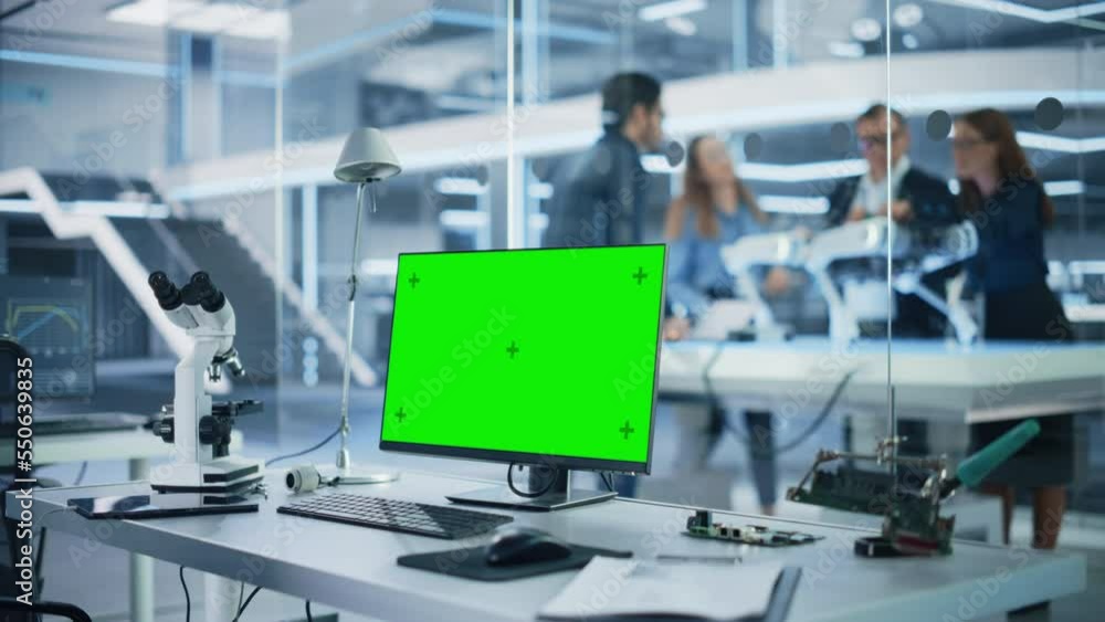 Aufkleber Industrial Research Laboratory with Desktop Computer with Green Screen Mock Up Display. Scientific Lab, Engineering Research Center with Specialists Working on Robot Development in the Background.