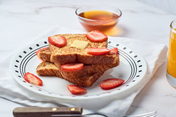 French toast with strawberries and honey, healthy breakfast.